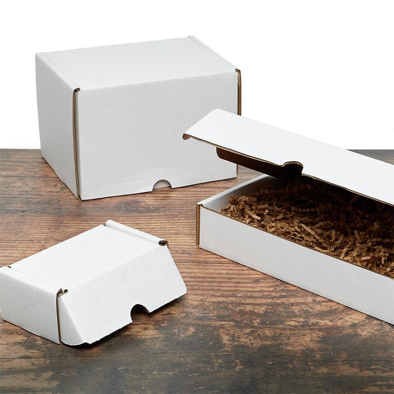 Small kraft paper folding gift box with tuck top and snap-lock bottom