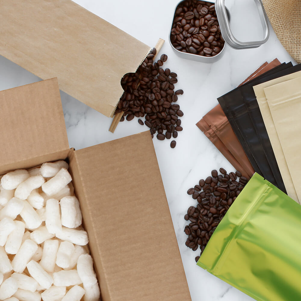 flat lay of paper mart coffee packaging and shipping supplies